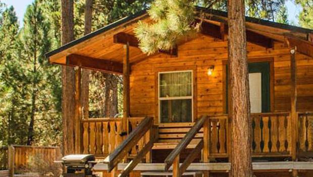 A deluxe cabin at LaPine State Park, complete with covered wraparound deck.
